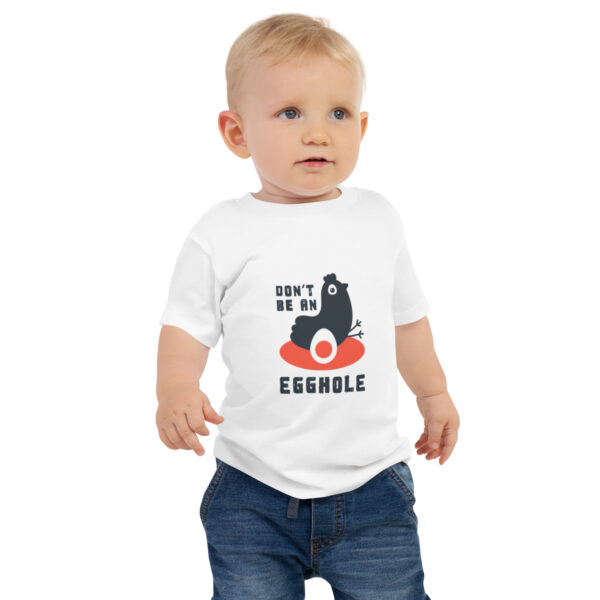 A toddler wearing jeans and a t-shirt.