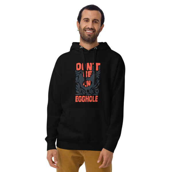 A man wearing an upside down hoodie with the words " don 't be evil enough ".