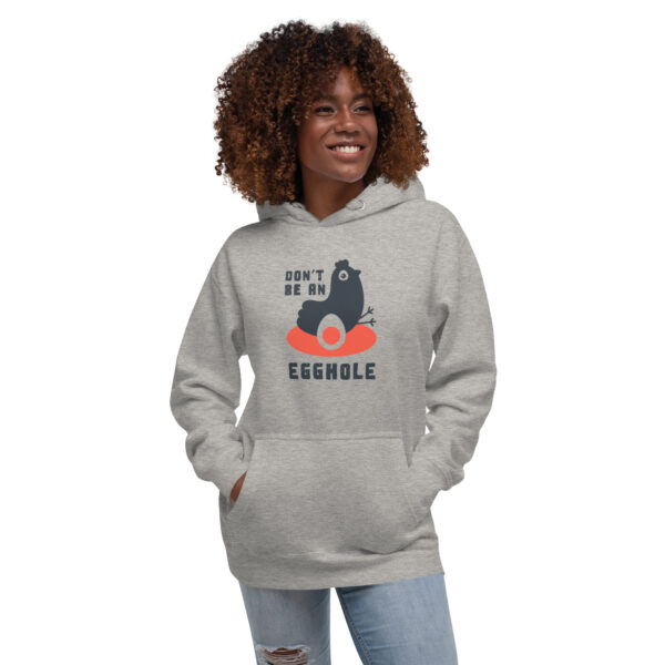 A woman wearing a hoodie with an image of a gorilla.