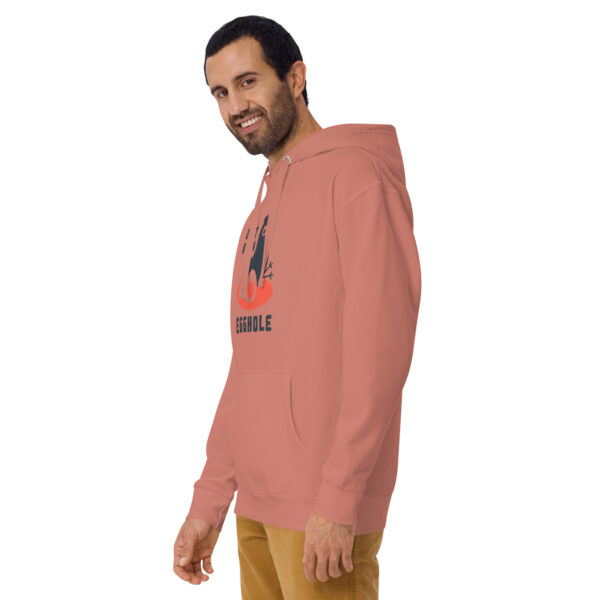 A man wearing a pink hoodie with an orange logo.