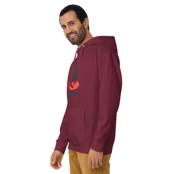 A man wearing a maroon hoodie with an orange bird on it.