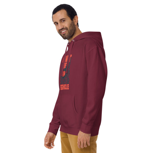 A man wearing a maroon hoodie with an image of a person.