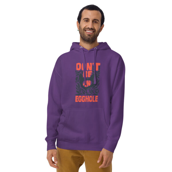 A man wearing an orange and purple hoodie.