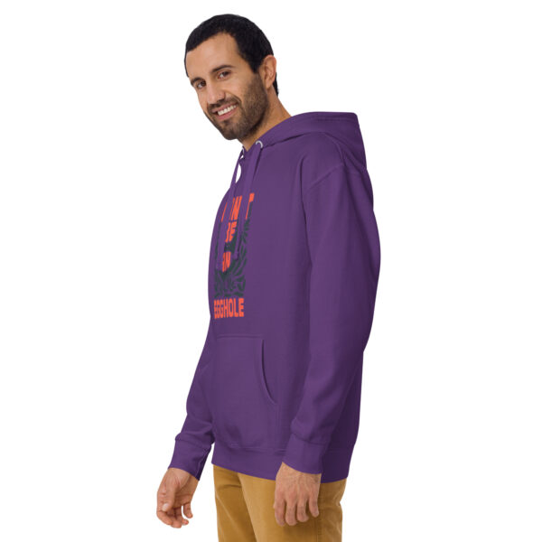 A man wearing a purple hoodie with the word " hawaii " on it.