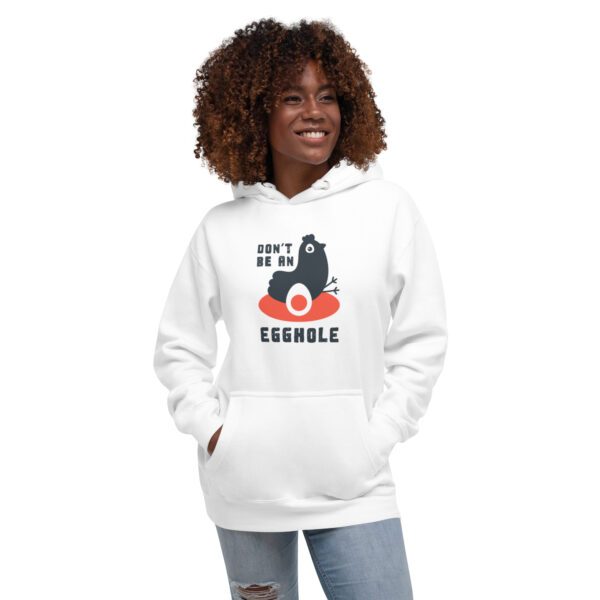 A woman wearing a white hoodie with an image of a cat.