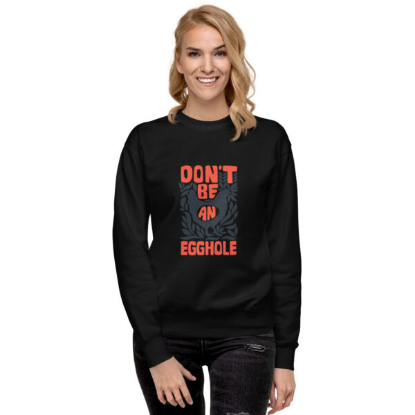 A woman wearing a black sweatshirt with the words don 't sit on an obstacle.