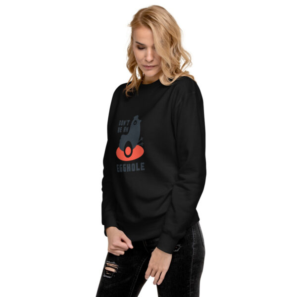 A woman wearing black sweatshirt with an image of a cat.