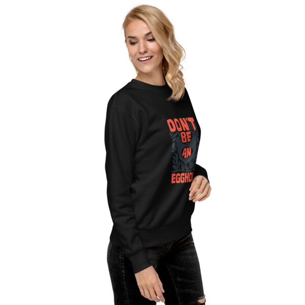 A woman wearing black sweatshirt with red lettering.