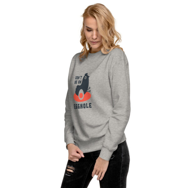 A woman wearing a sweatshirt with the words " handle " on it.