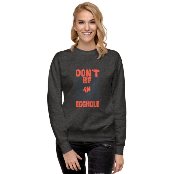 A woman wearing a sweatshirt that says don 't be an asshole.