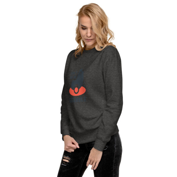 A woman wearing an upside down umbrella sweatshirt.