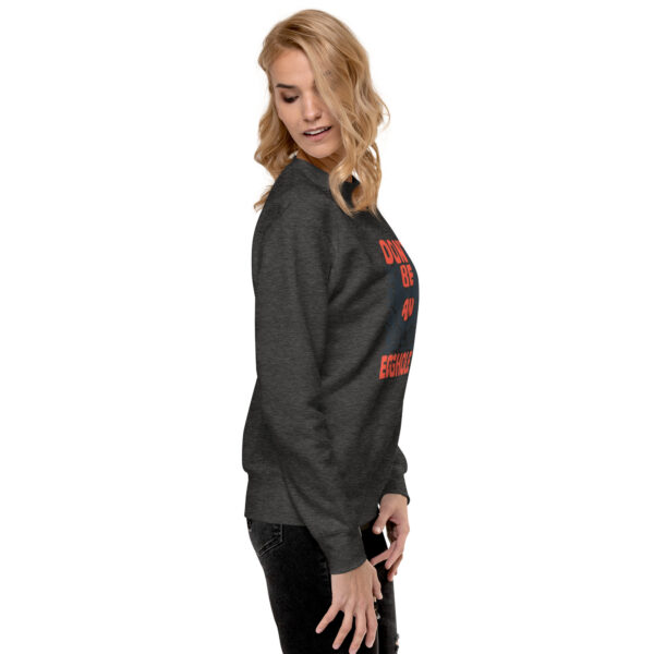 A woman wearing a black sweatshirt with red lettering.