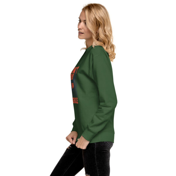 A woman in green sweatshirt with the word " christmas ".