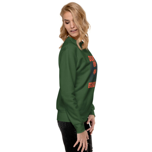 A woman wearing a green sweatshirt with an image of a tree.