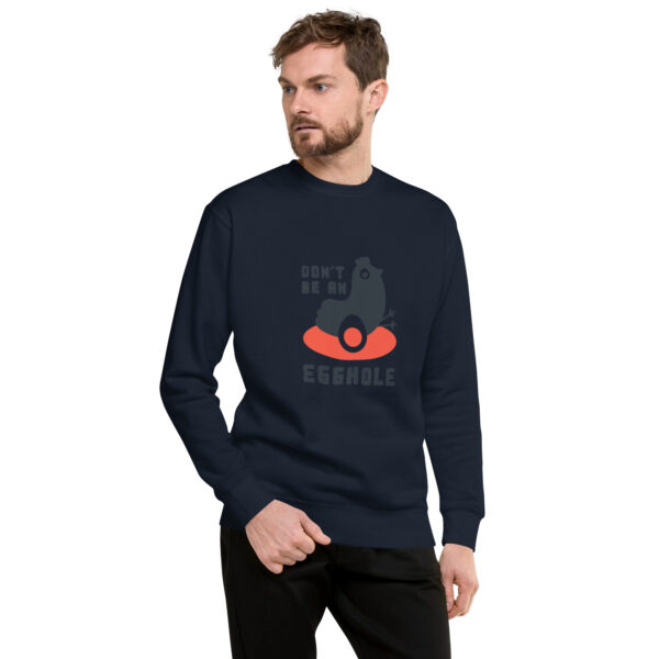 A man wearing a sweatshirt with an image of a cat on it.