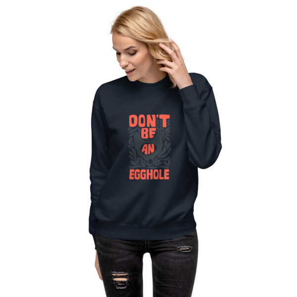 A woman wearing a sweatshirt with the words " don 't be an obstacle ".