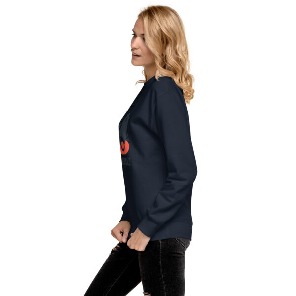 A woman in black sweatshirt with red logo