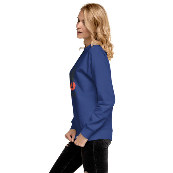 A woman in blue sweatshirt with red lettering