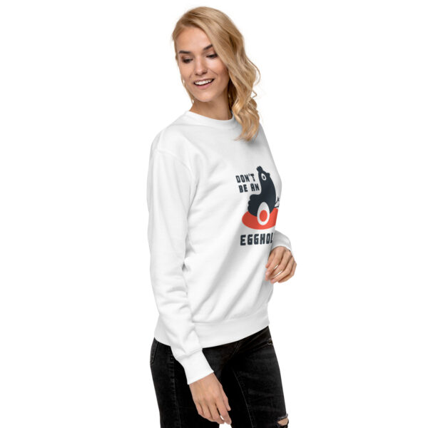 A woman wearing a white sweatshirt with a picture of a dog.