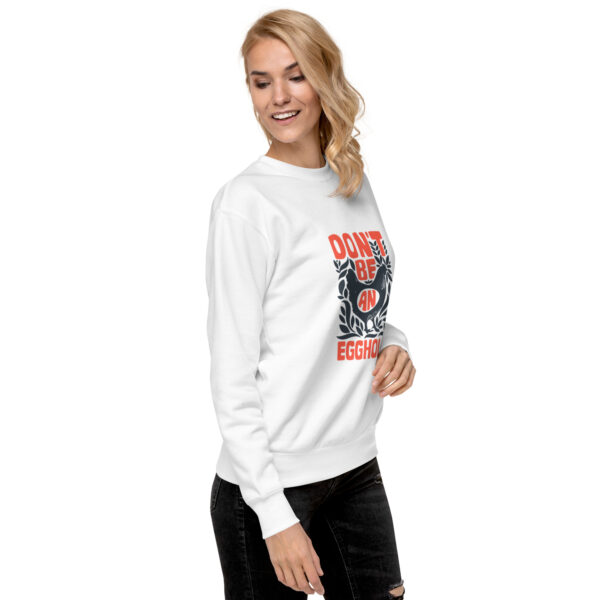 A woman wearing a white sweatshirt with an image of a tiger.