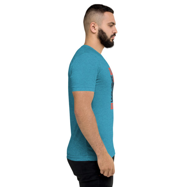 A man with a beard is wearing a blue shirt