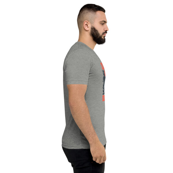 A man with a beard is wearing a t-shirt