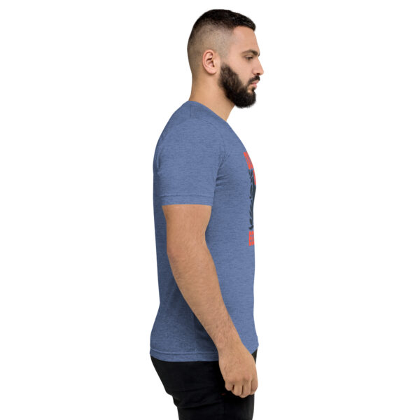 A man with a beard is wearing a blue shirt