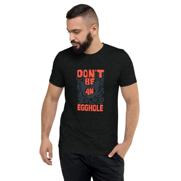 A man wearing a t-shirt that says don 't be an obstacle.