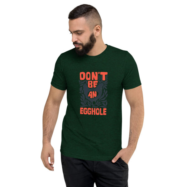 A man wearing a t-shirt that says don 't be an obstacle.