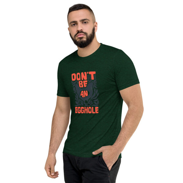 A man wearing a t-shirt that says don 't be an asshole.