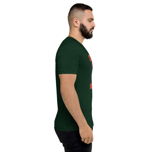 A man with a beard is wearing a green shirt