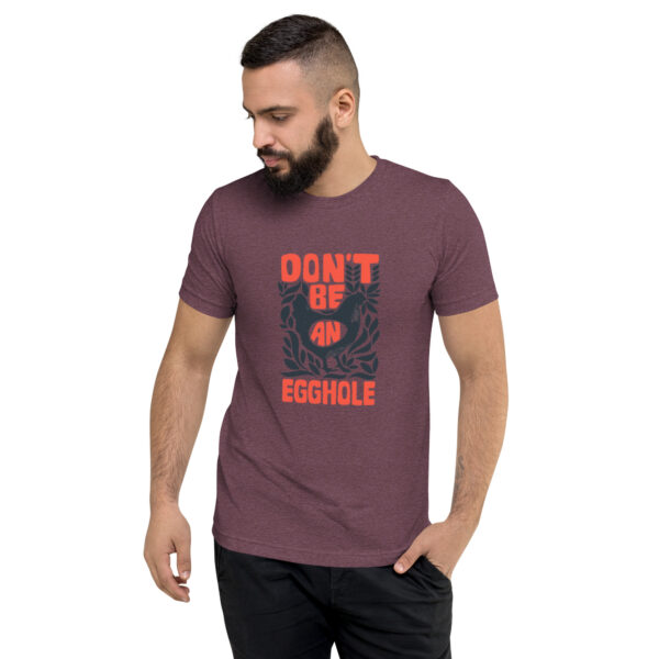 A man wearing a t-shirt that says don 't be humble.