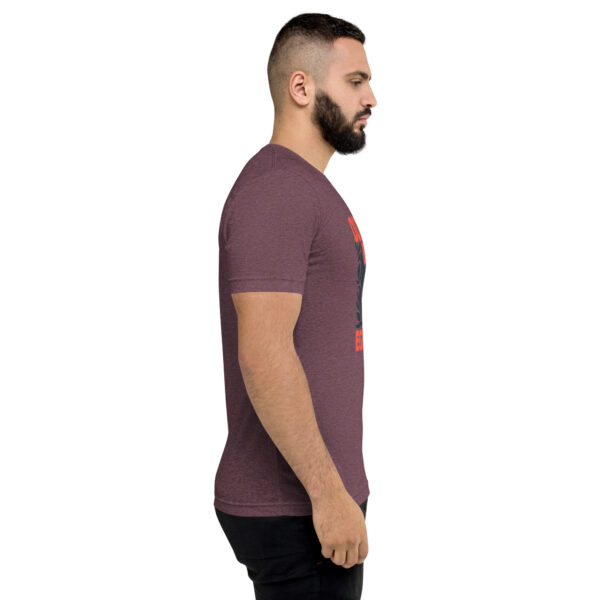 A man with a beard is wearing a t-shirt