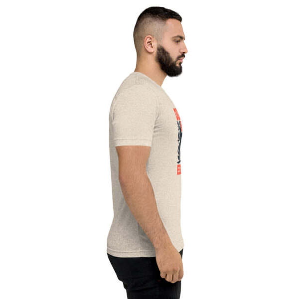 A man with a beard is wearing a t-shirt