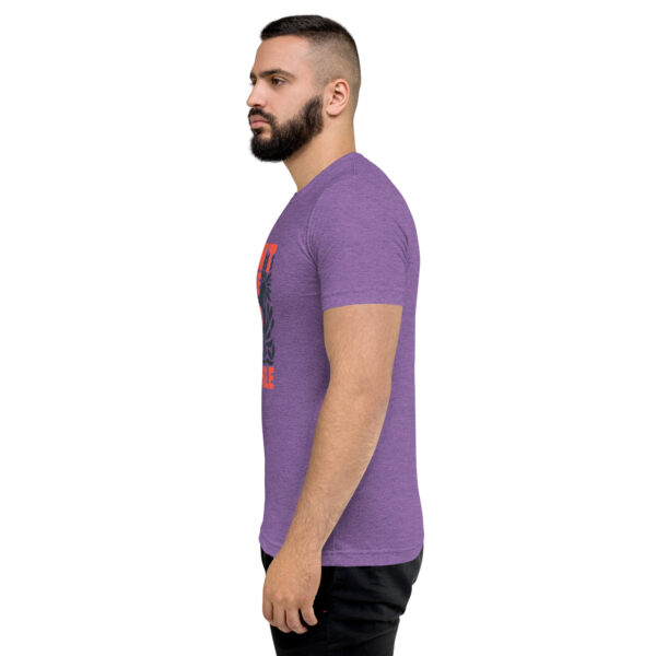 A man wearing a purple t-shirt with an image of a person.