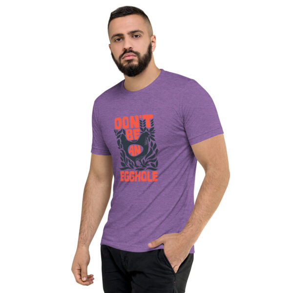 A man wearing a purple t-shirt with the words don 't be angry.