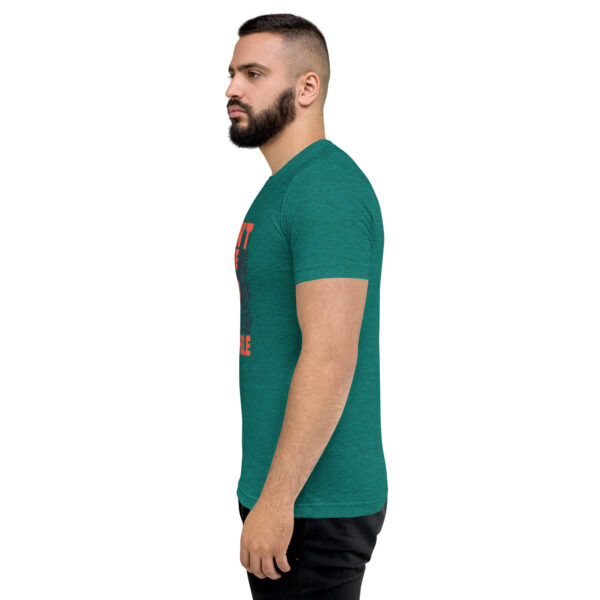 A man with a beard is wearing a green shirt