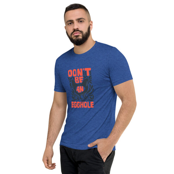 A man wearing a blue t-shirt with the words don 't up missile on it.