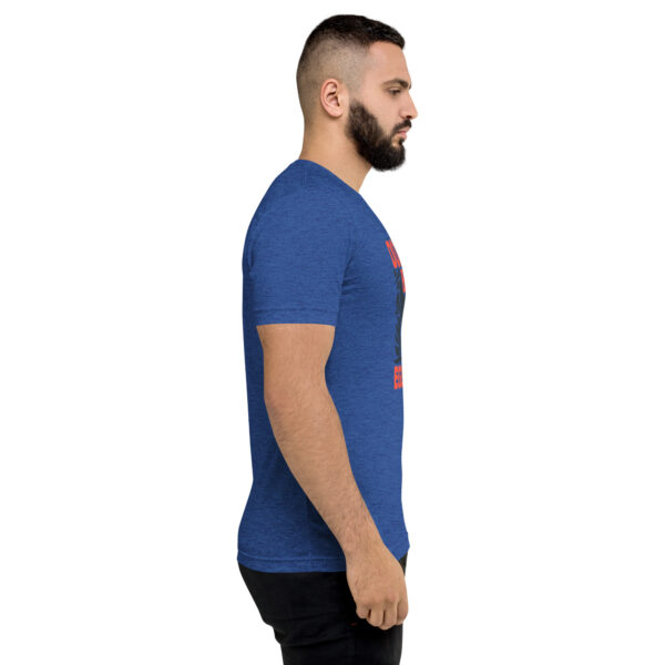 A man with a beard is wearing a blue shirt