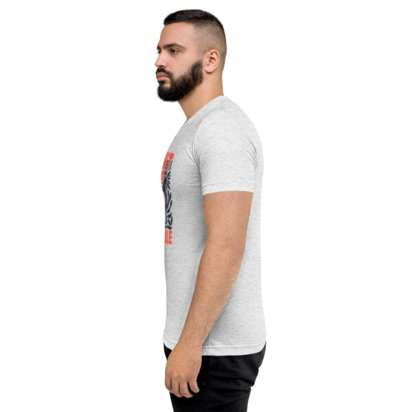 A man with a beard is wearing a t-shirt