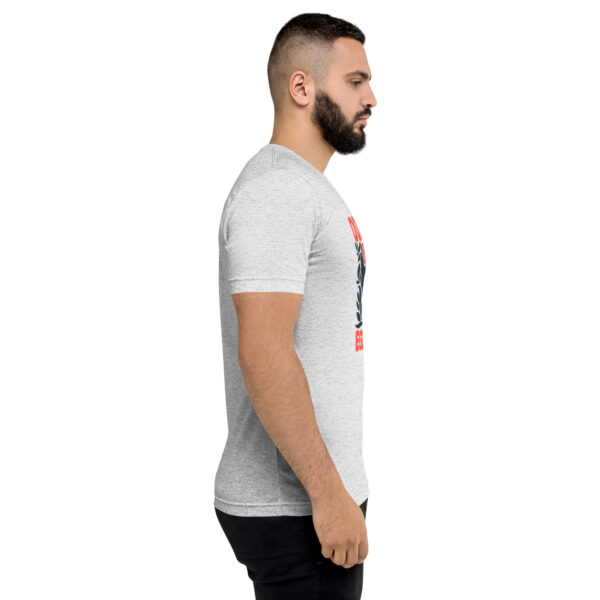 A man with a beard is wearing a t-shirt