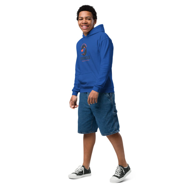 A man in blue shorts and a hoodie