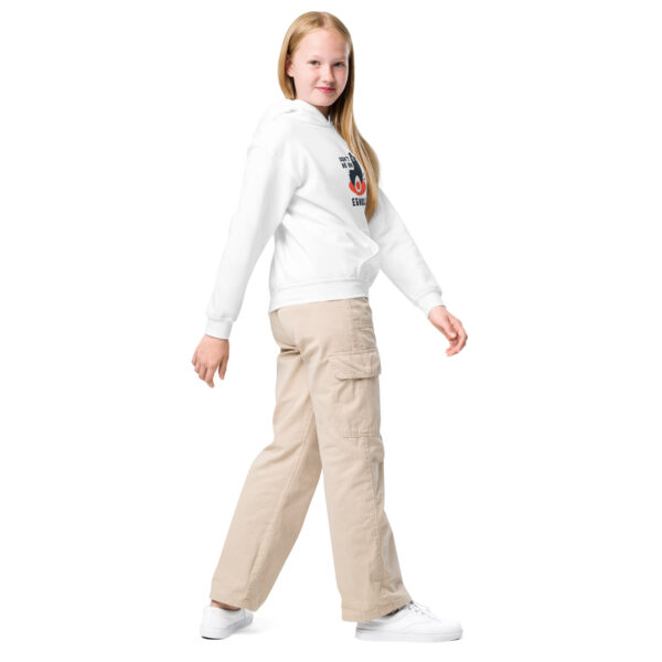 A girl in white shirt and beige pants