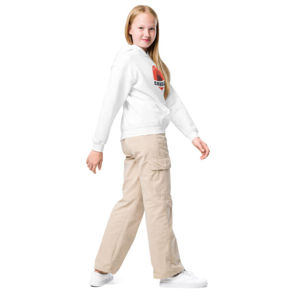 A girl in white shirt and beige pants