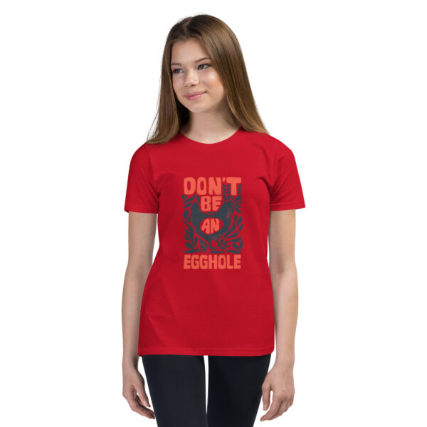 A girl wearing a red t-shirt with the words don 't google.