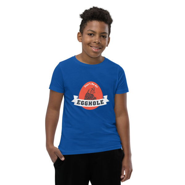 A kid wearing a blue t-shirt with the word brooklyn on it.