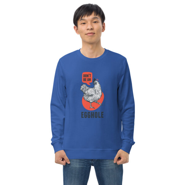 A man wearing a sweatshirt with an image of a cat.