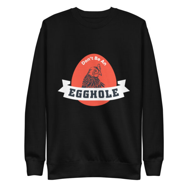 A black sweatshirt with an egg hole logo on it.