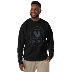 A man wearing a black sweatshirt with an image of a rooster.