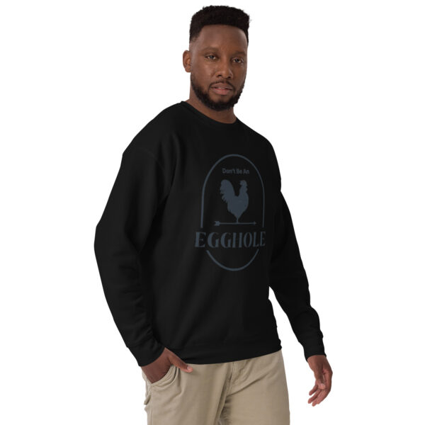 A man wearing a black sweatshirt with the words " equality ".